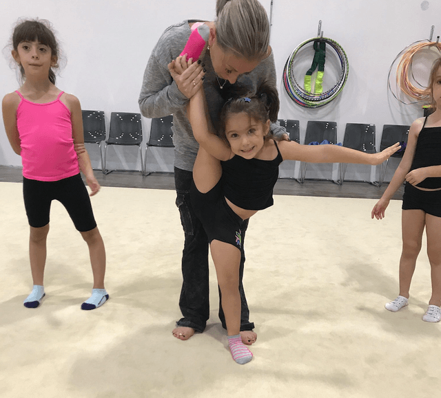 Beginner rhythmic gymnast with hoop