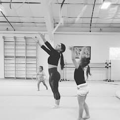 Young gymnast in preschool rhythmic gymnastics class